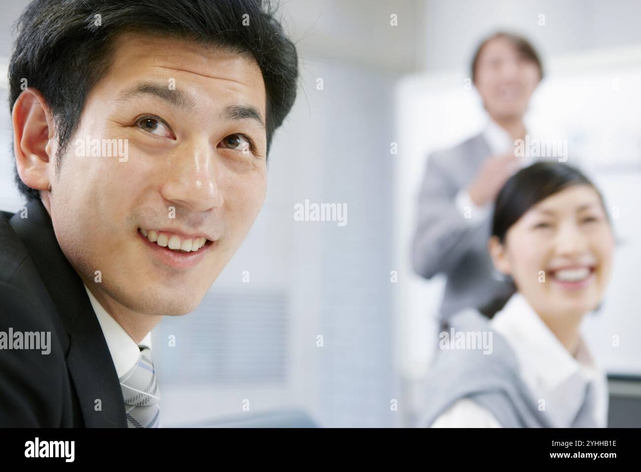 Uomini d'affari a una riunione aziendale Foto Stock