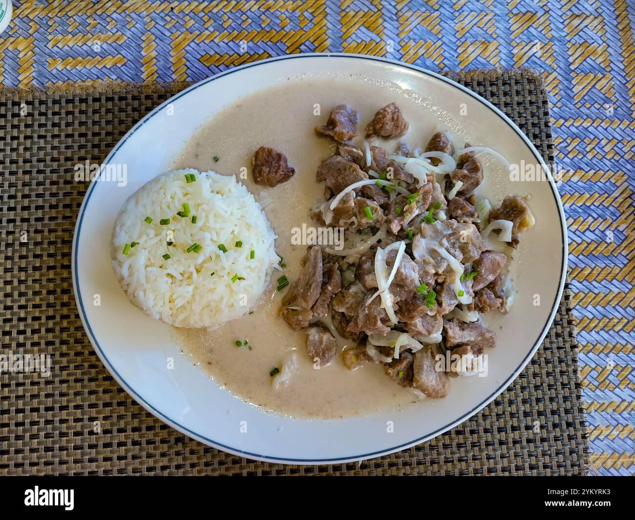 Piatto di capra in latte di cocco e riso, Hiva oa, Isole Marchesi, Polinesia francese Foto Stock