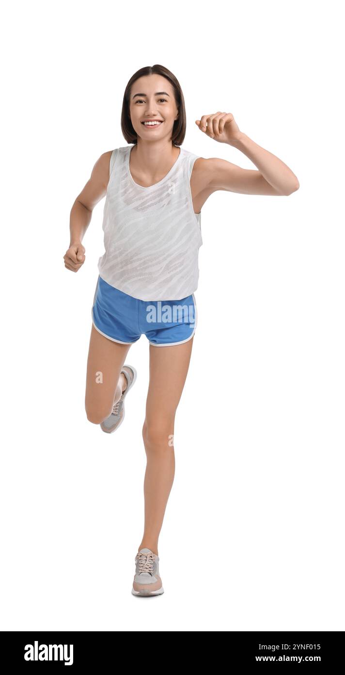 Bella donna in abbigliamento sportivo che corre su sfondo bianco Foto Stock