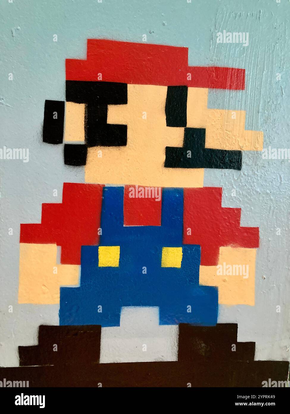 Super Mario in un disegno pixelato sulla parete di un caffè a Londra, Inghilterra Foto Stock