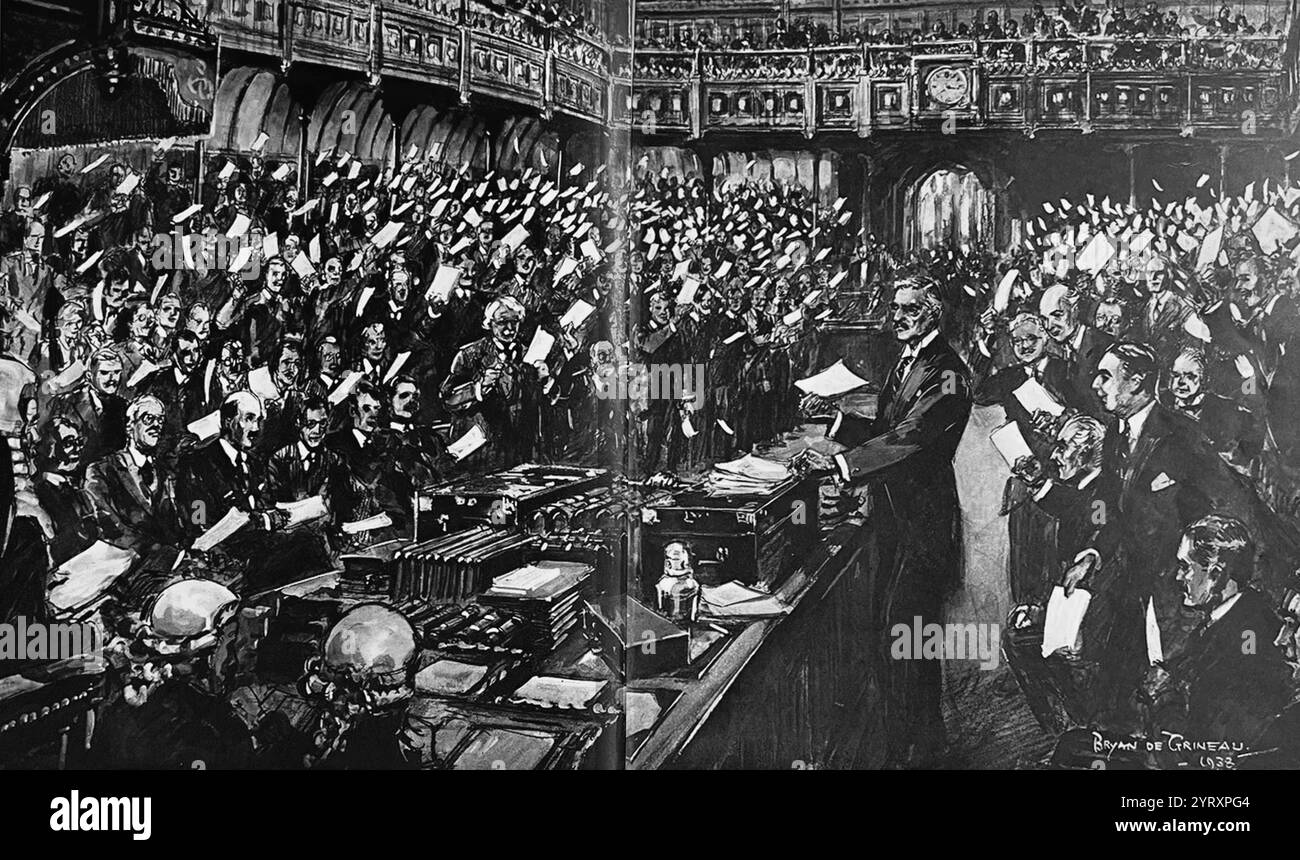 Il primo ministro britannico Neville Chamberlain si rivolge al Parlamento dopo essere tornato da Monaco con l'accordo di Monaco, raggiunto il 30 settembre 1938, da Germania, Gran Bretagna, Repubblica francese e Italia. Esso prevedeva l'annessione tedesca di parte della Cecoslovacchia chiamata Sudeti, dove vivevano più di tre milioni di persone, principalmente di etnia tedesca. Hitler, Mussolini e Goring erano presenti. Foto Stock