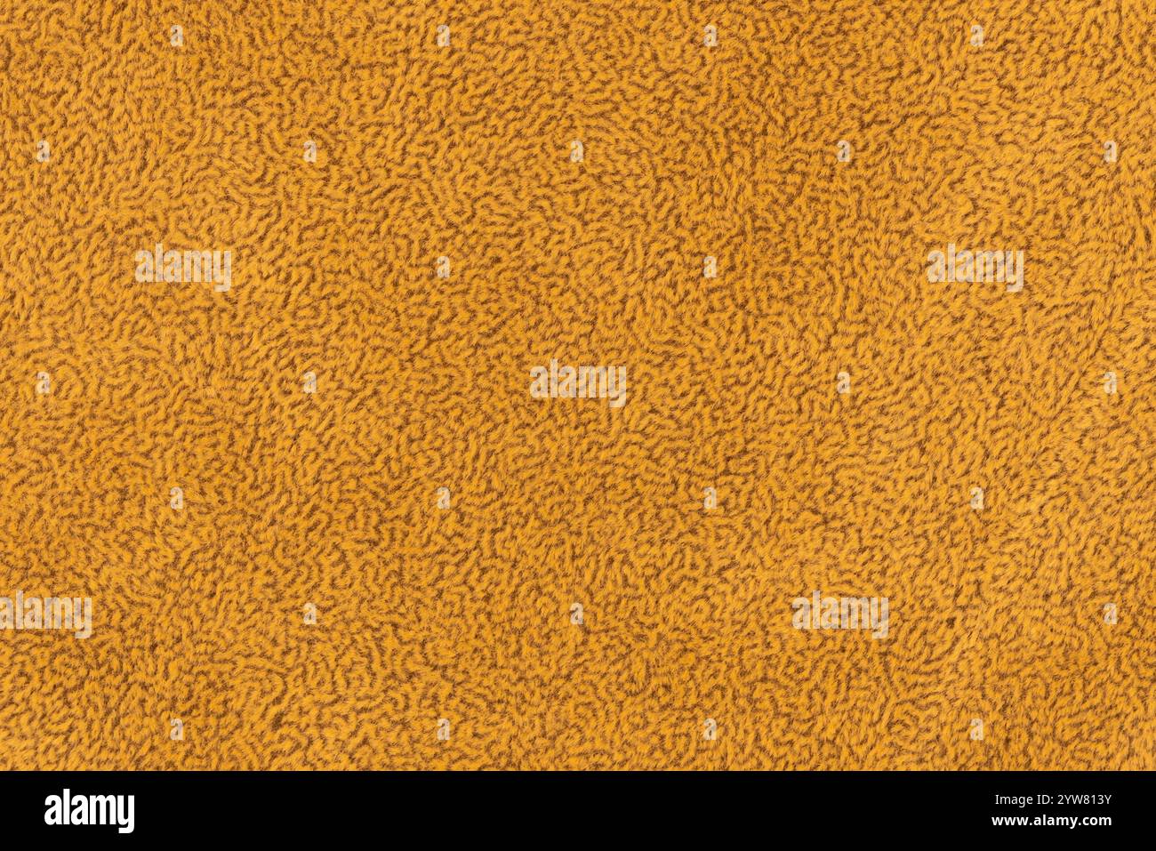 Tessuto di colore giallo con fondo morbido e dai capelli corti. Primo piano di materiale tessile per superfici di colore giallastro, sfondo f Foto Stock