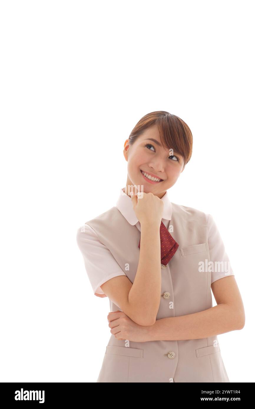 Giovane donna in uniforme in posa mentale Foto Stock