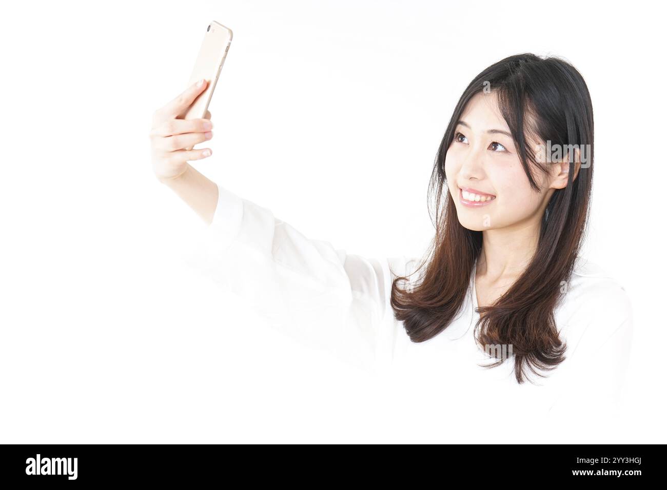 Giovane donna prendendo un selfie Foto Stock