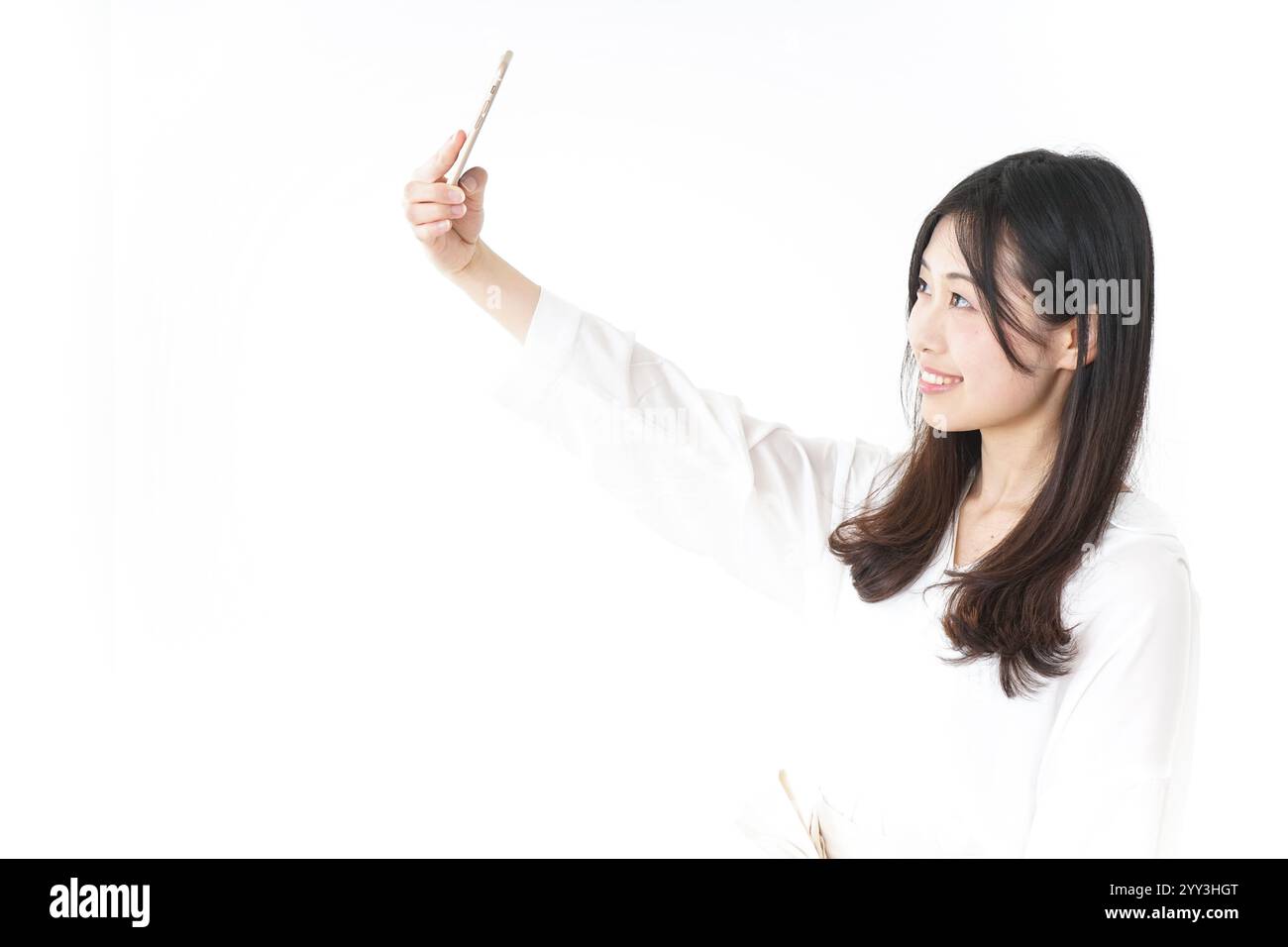 Giovane donna prendendo un selfie Foto Stock