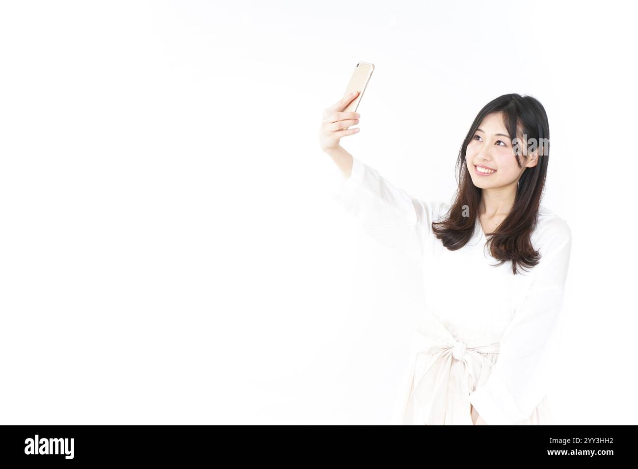 Giovane donna prendendo un selfie Foto Stock