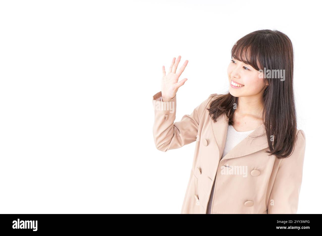 Donna che indossa un cappotto Foto Stock