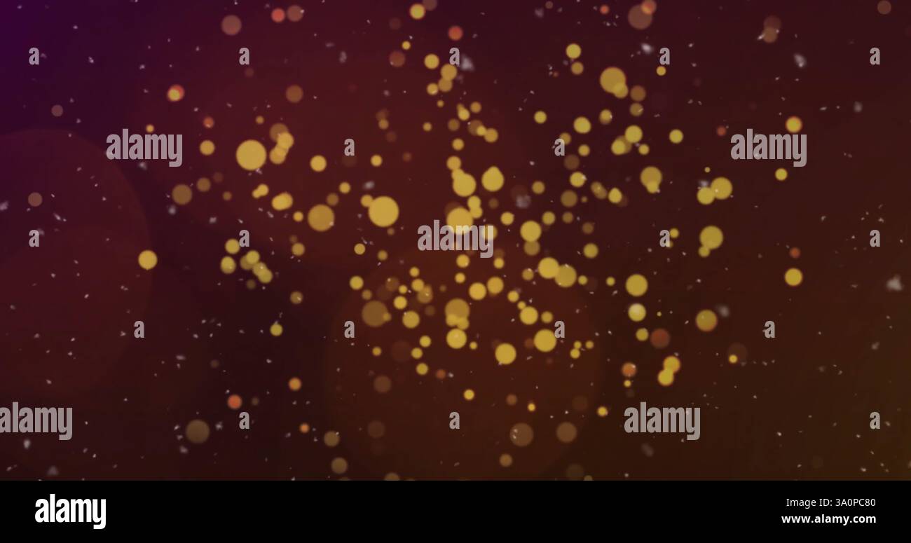 Immagine di macchie luminose dorate che si innalzano su sfondo scuro Foto Stock