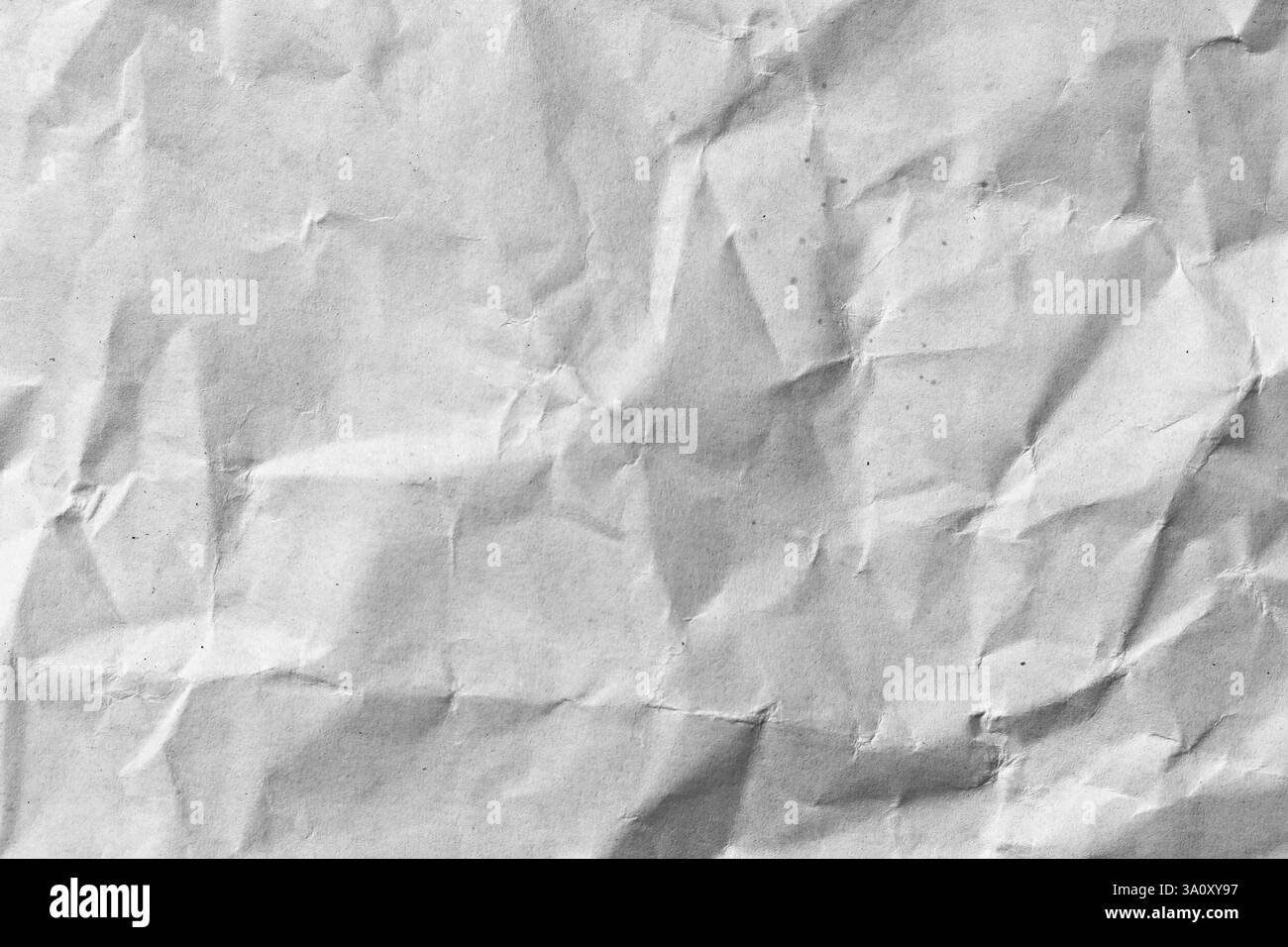 Vista ravvicinata di un white paper sfogliato che mostra una texture astratta che aggiunge profondità e carattere. Ideale per progetti artistici o di background. Foto Stock