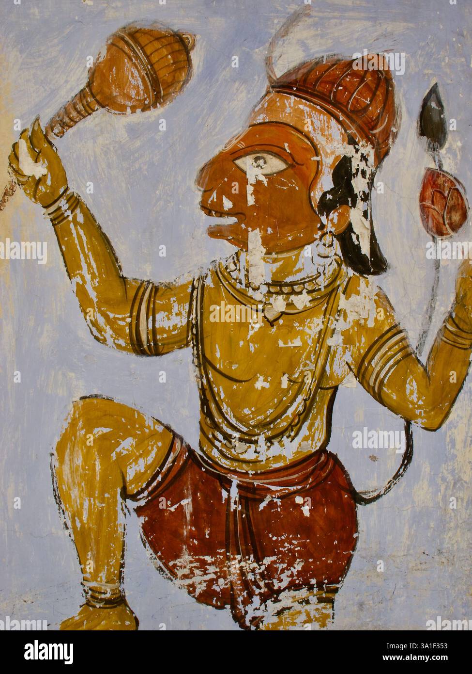 Un murale intemprato di Hanuman, il dio della scimmia, che tiene una mazza e un loto, simboleggia la forza e la devozione nella mitologia indù. Foto Stock Un murale intemprato di Hanuman, il dio della scimmia, che tiene una mazza e un loto, simboleggia la forza e la devozione nella mitologia indù. Foto Stock