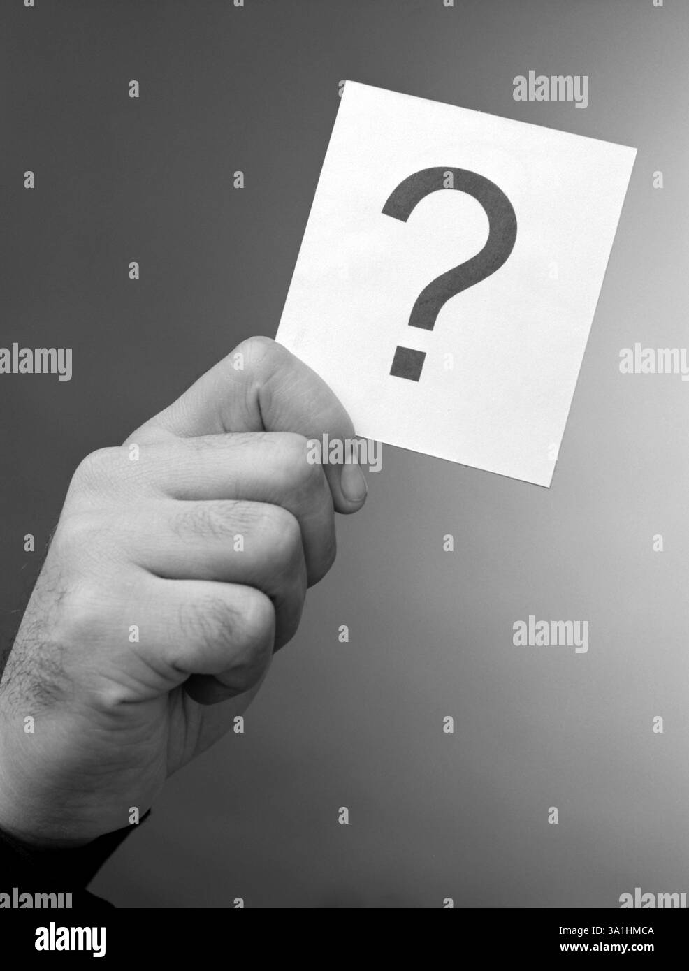 Mano e punto interrogativo Foto Stock