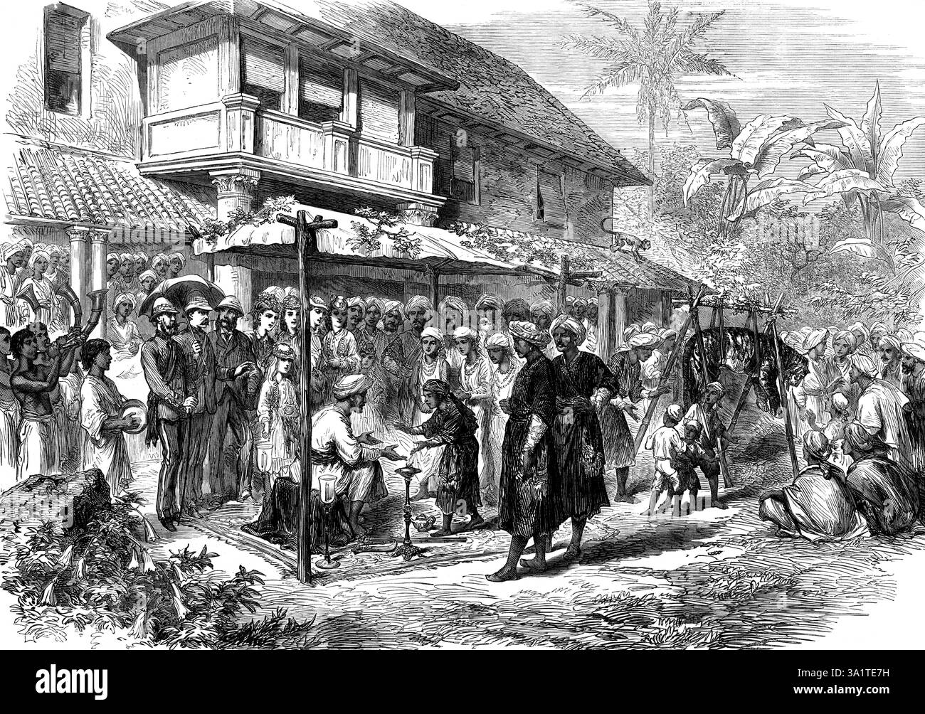 Un matrimonio di tigre a Coorg, India, 1873. Incisione di uno schizzo del capitano Belford Cummins, del corpo dello staff di Mercara. Una curiosa cerimonia si svolge quando una tigre è stata uccisa da un uomo Coorg. Le tigri non sono numerose nel paese, e questa cerimonia è avvenuta solo due volte negli ultimi quattro anni. Nell'ultima occasione, il cacciatore di successo fu Colovanda Carriapah, capo Sheristadar del Mercara Talook. In questa cerimonia l'uomo è sposato con l'anima della tigre morta... è seduto sotto un baldacchino in costume da guerriero. Su ogni lato sono posizionate le sue armi e l'emblema della casa Foto Stock