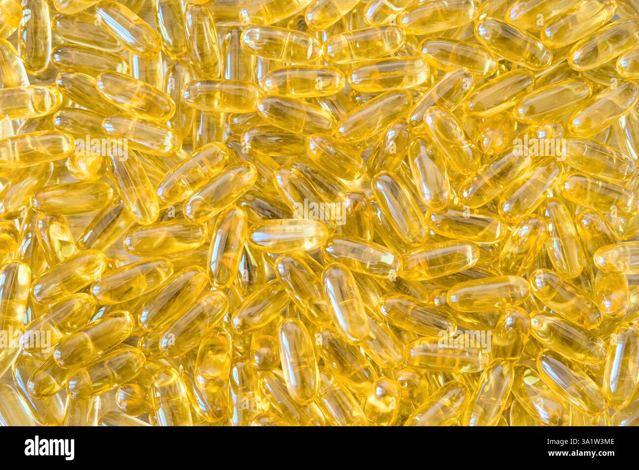Capsule di olio di pesce con sfondo di omega 3 e vitamina D. Concetto di assistenza sanitaria. Foto di alta qualità Foto Stock