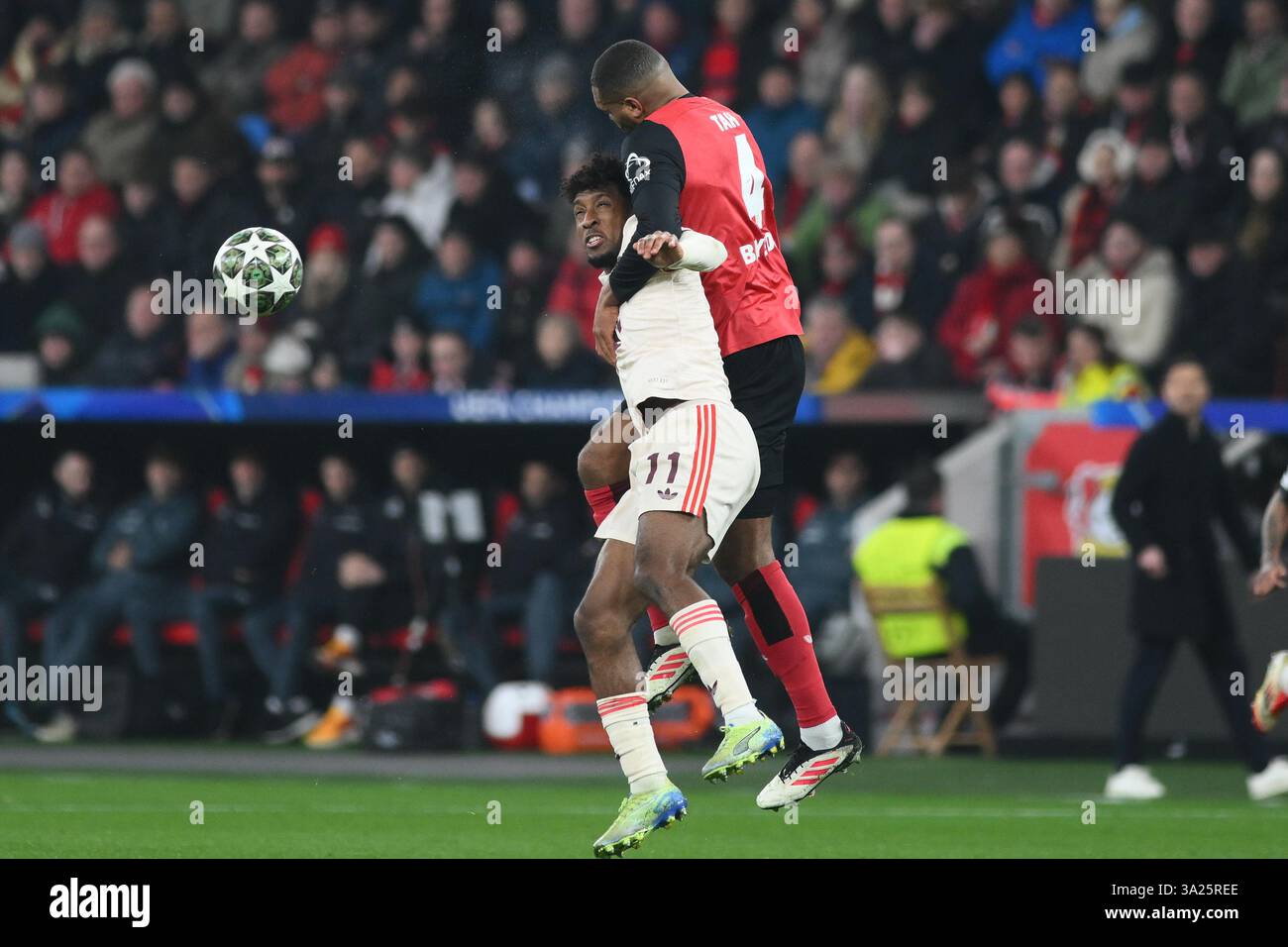 LEVERKUSEN, GERMANIA - 11 MARZO 2025: Jonathan Tah, Kingsley Coman - partita di calcio della UEFA Champions League tra Bayer 04 Leverkusen e FC Bayern Foto Stock