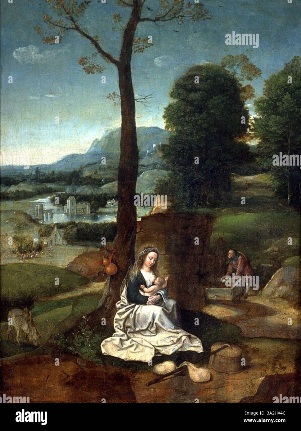 In questo dipinto di Adriaen Isenbrandt, la Sacra famiglia riposa durante la loro fuga in Egitto. La scena riflette un momento di tranquillo rifugio nel bel mezzo del loro viaggio. Foto Stock