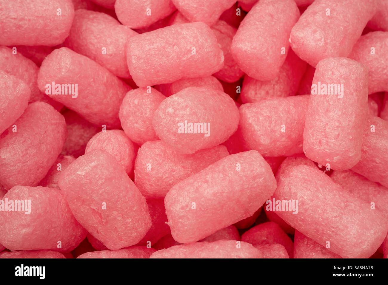 Riempimento scatola rosa e bianca come sfondo. Vista dall'alto. Foto Stock