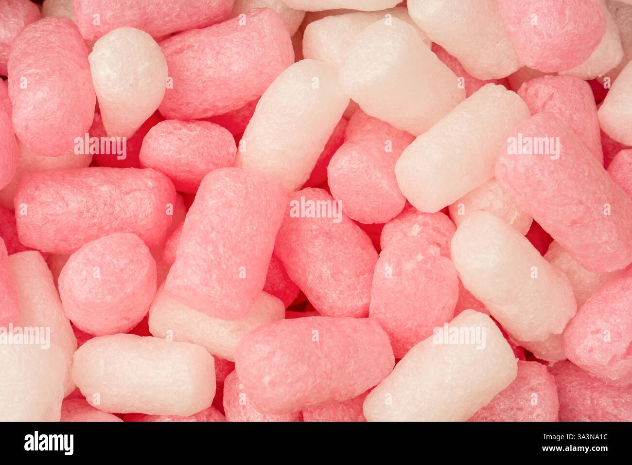 Riempimento scatola rosa e bianca come sfondo. Vista dall'alto. Foto Stock