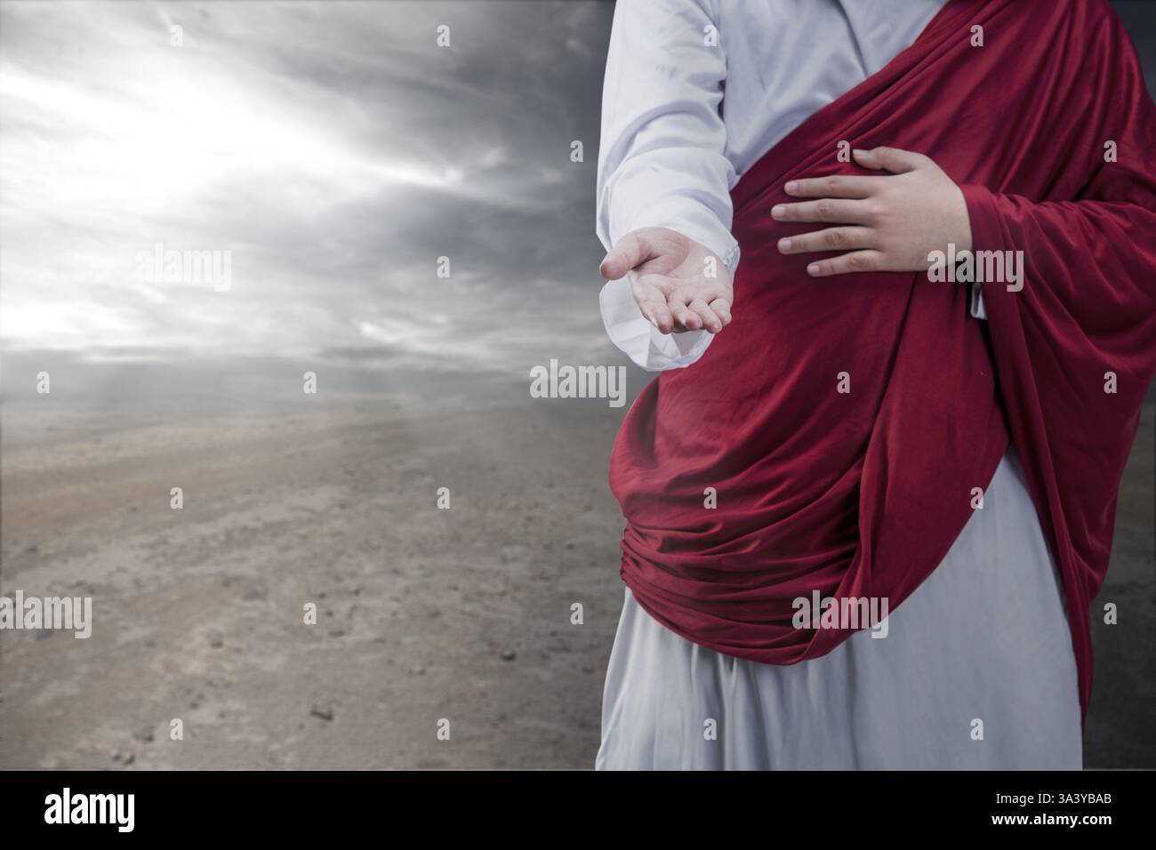 Gesù Cristo che si allontana a braccia aperte. Concetto di cristianesimo, fede e spiritualità Foto Stock