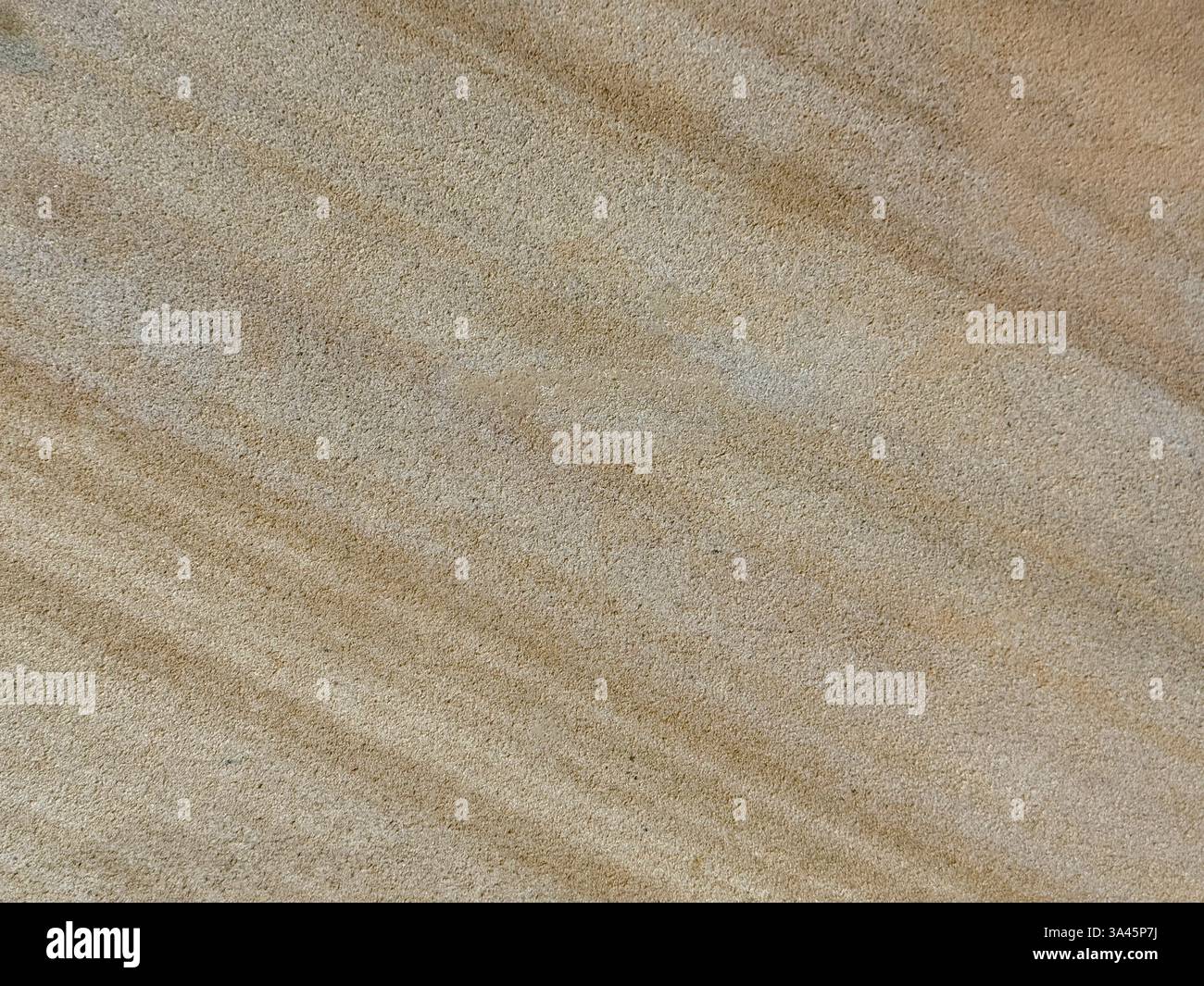 Primo piano con motivo a lastre di granito beige e pietra crema naturale in venature e grani dall'aspetto marmoreo, consistenza senza cuciture Foto Stock