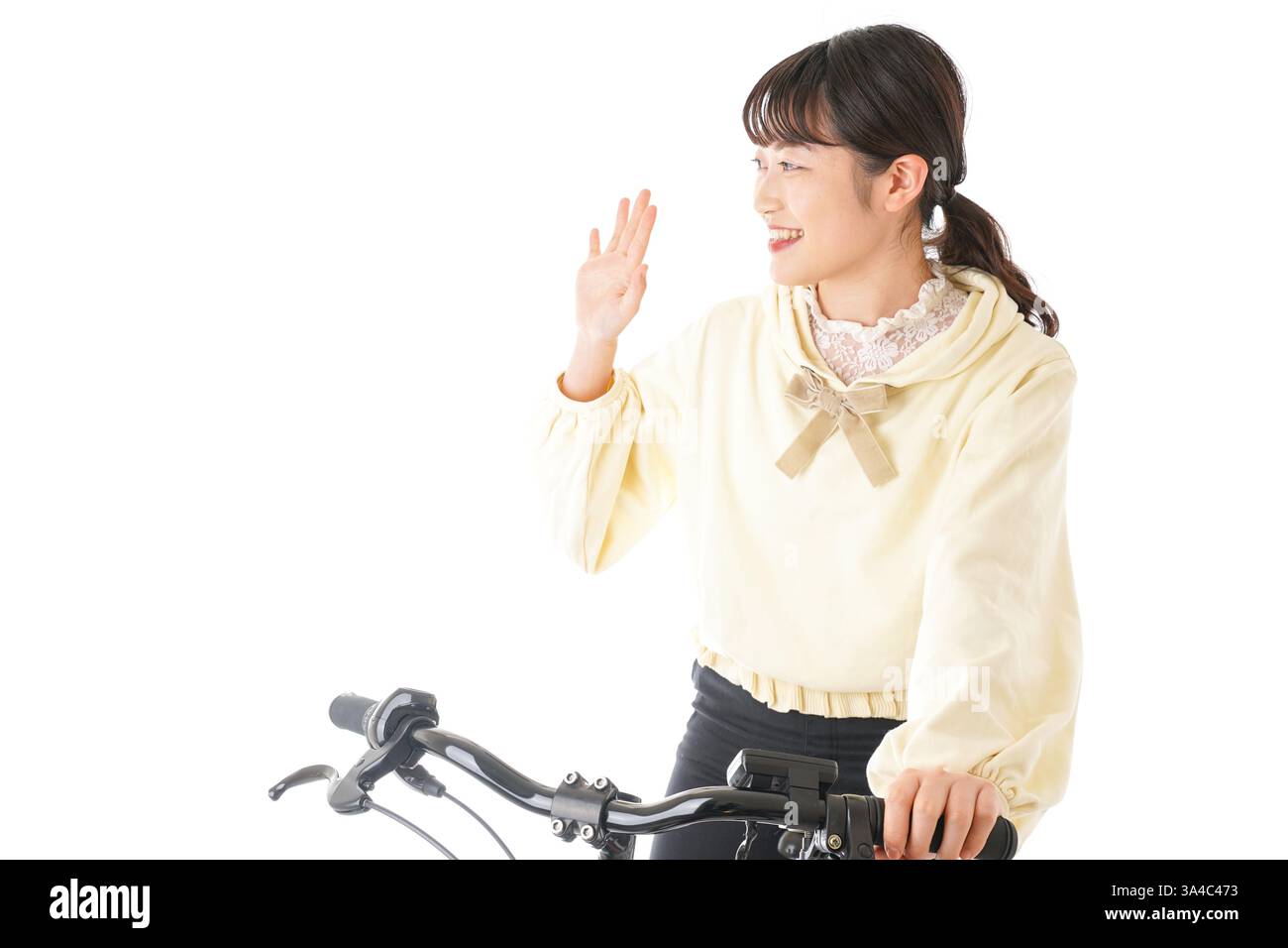 Giovane donna di una bicicletta Foto Stock