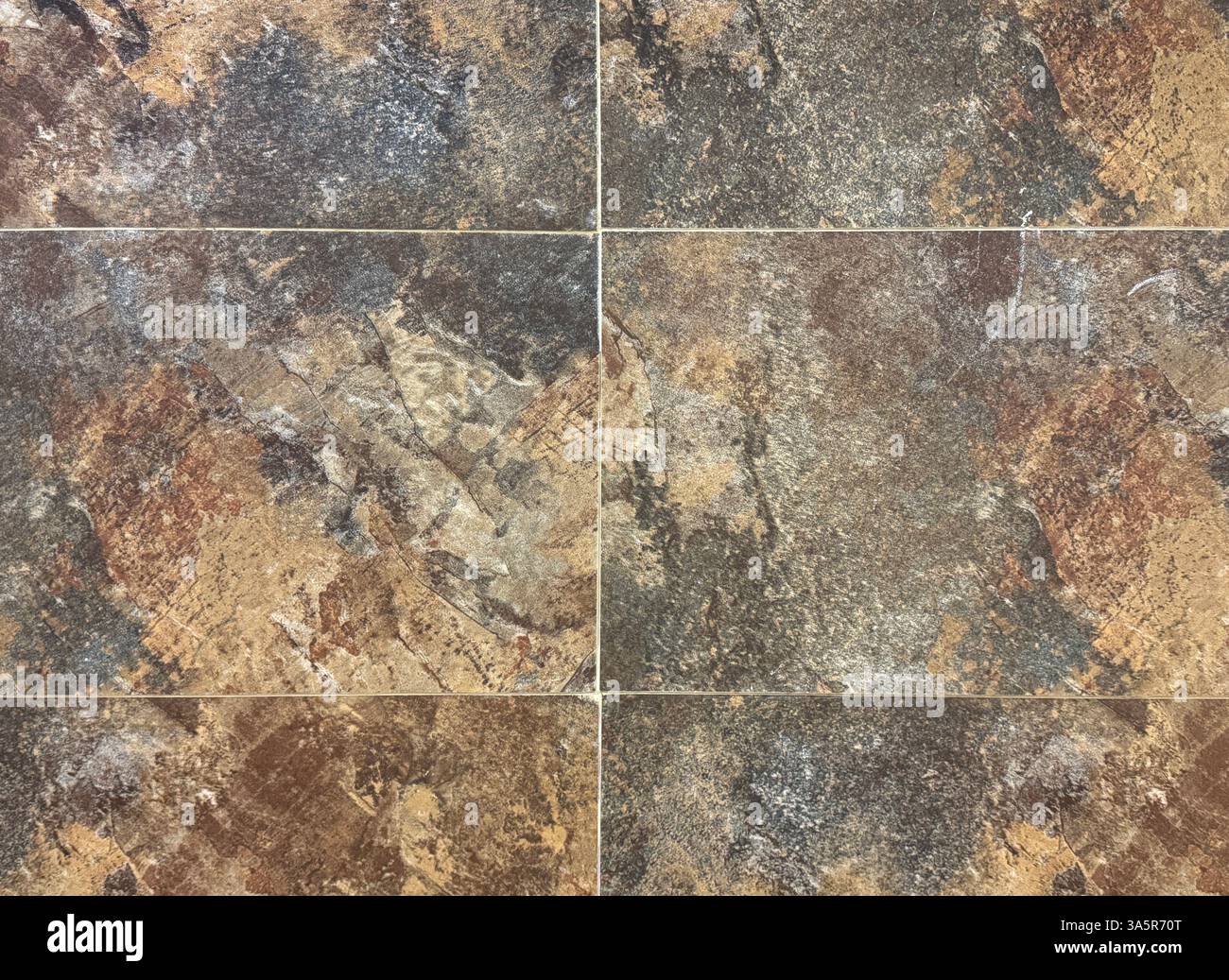 Primo piano di granito arrugginito e resistente agli agenti atmosferici, adatto per pavimenti esterni ed esterni. Colore ossidato, rame e grigio. bac in pietra senza cuciture Foto Stock