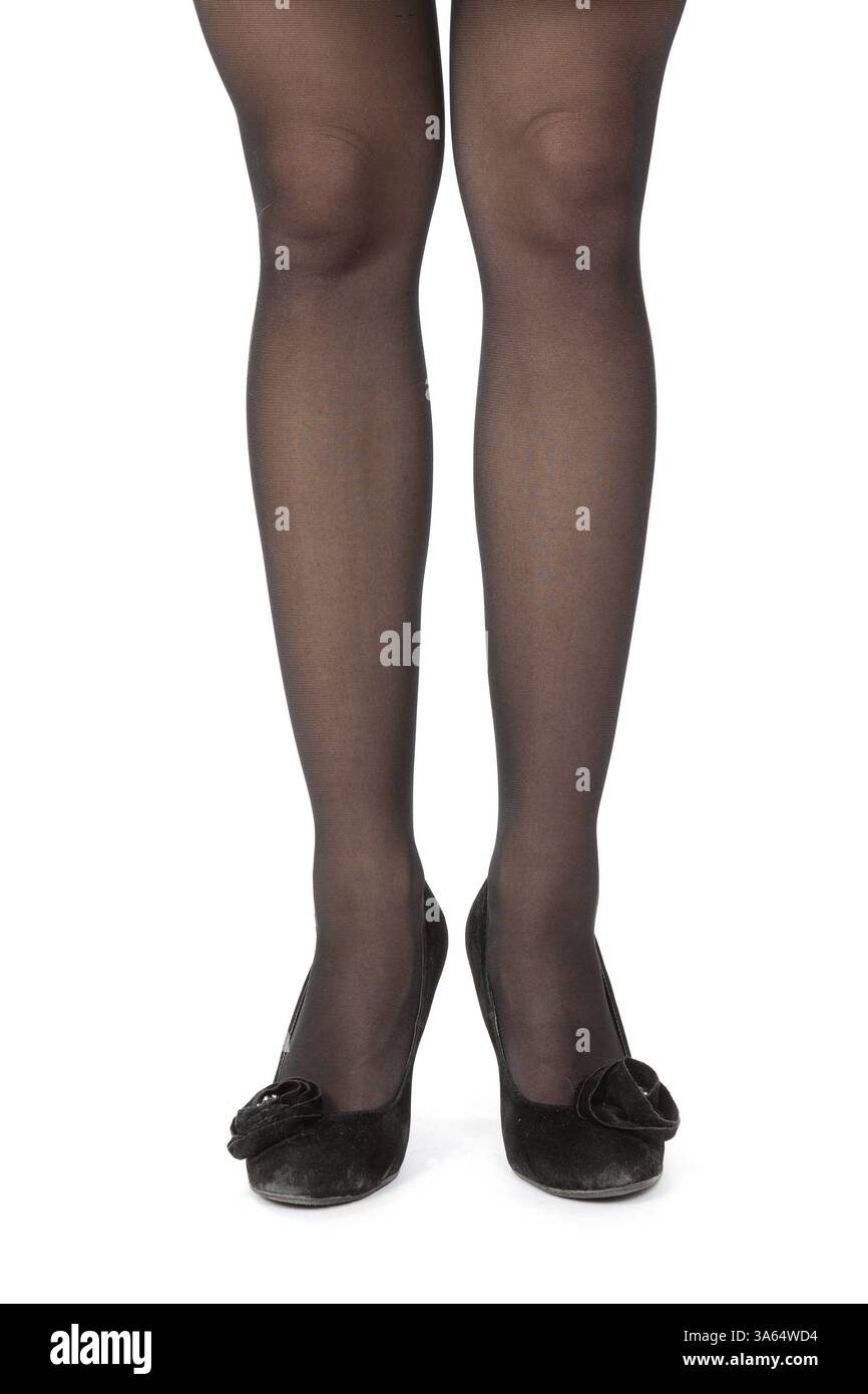 Donne sottili gambe in collant e tacchi alti e scarpe Foto Stock