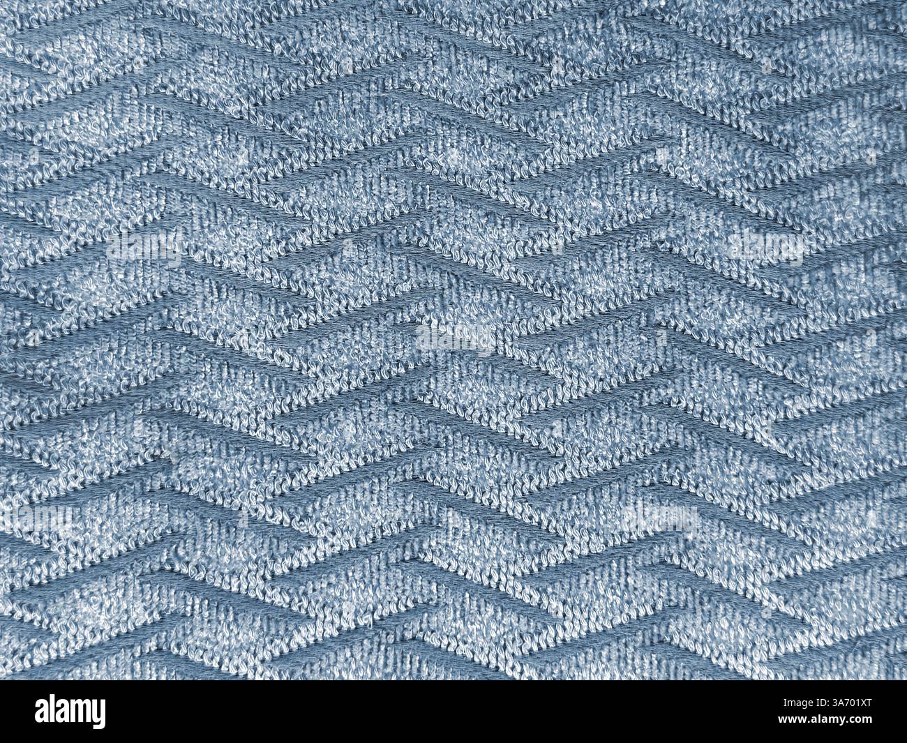 Primo piano di tessuto blu con motivo a filo ondulato. Tessuto blu con tessitura a chevron, fondo senza cuciture. Foto Stock