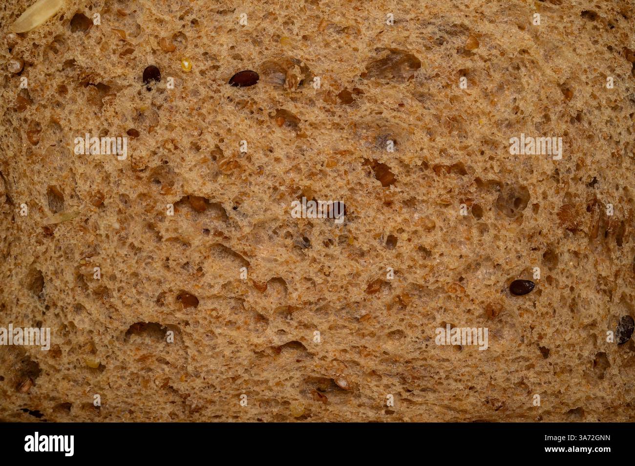 Primo piano di fette di pane integrale con semi Foto Stock