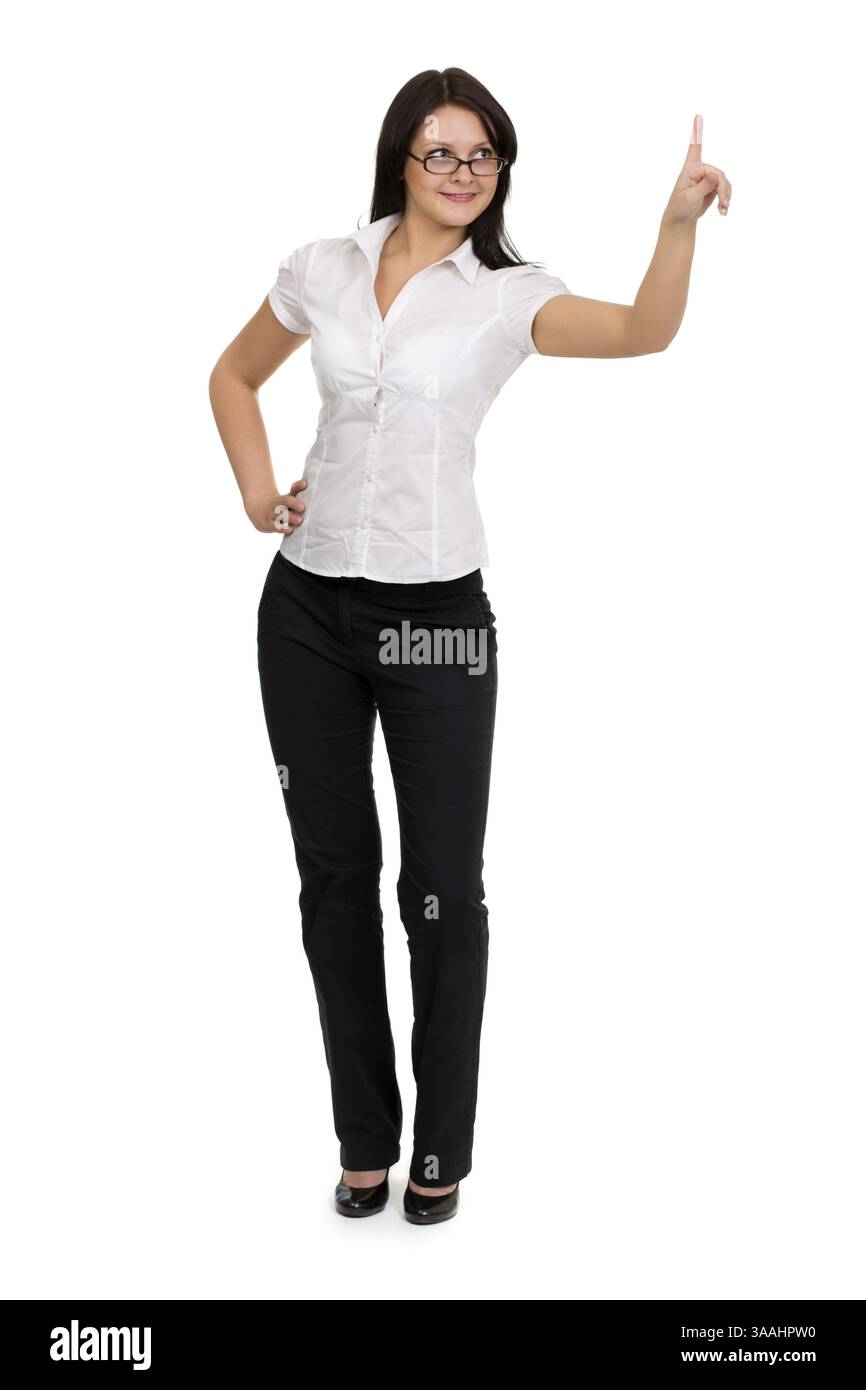 Brunette imprenditrice toccando virtual pad tasto trasparente con un dito Foto Stock