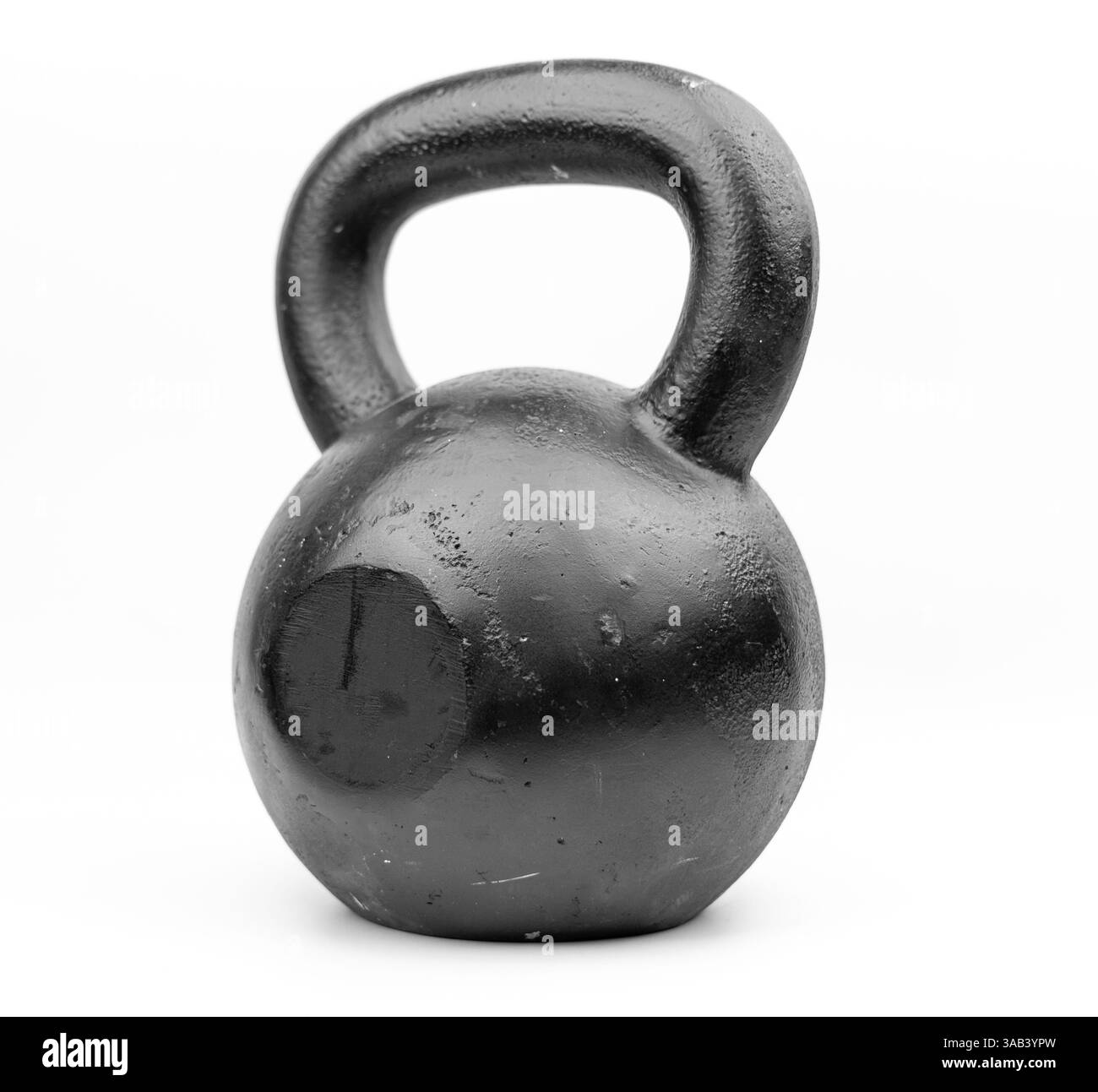 Un campanello in metallo nero in ghisa per lo sport su uno sfondo bianco isolato. Foto Stock