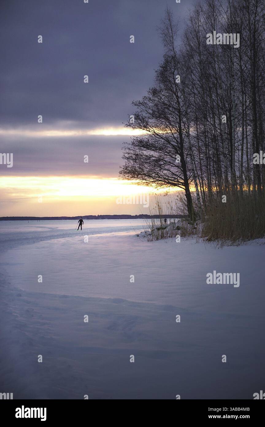 Tramonto sul lago ghiacciato Foto Stock