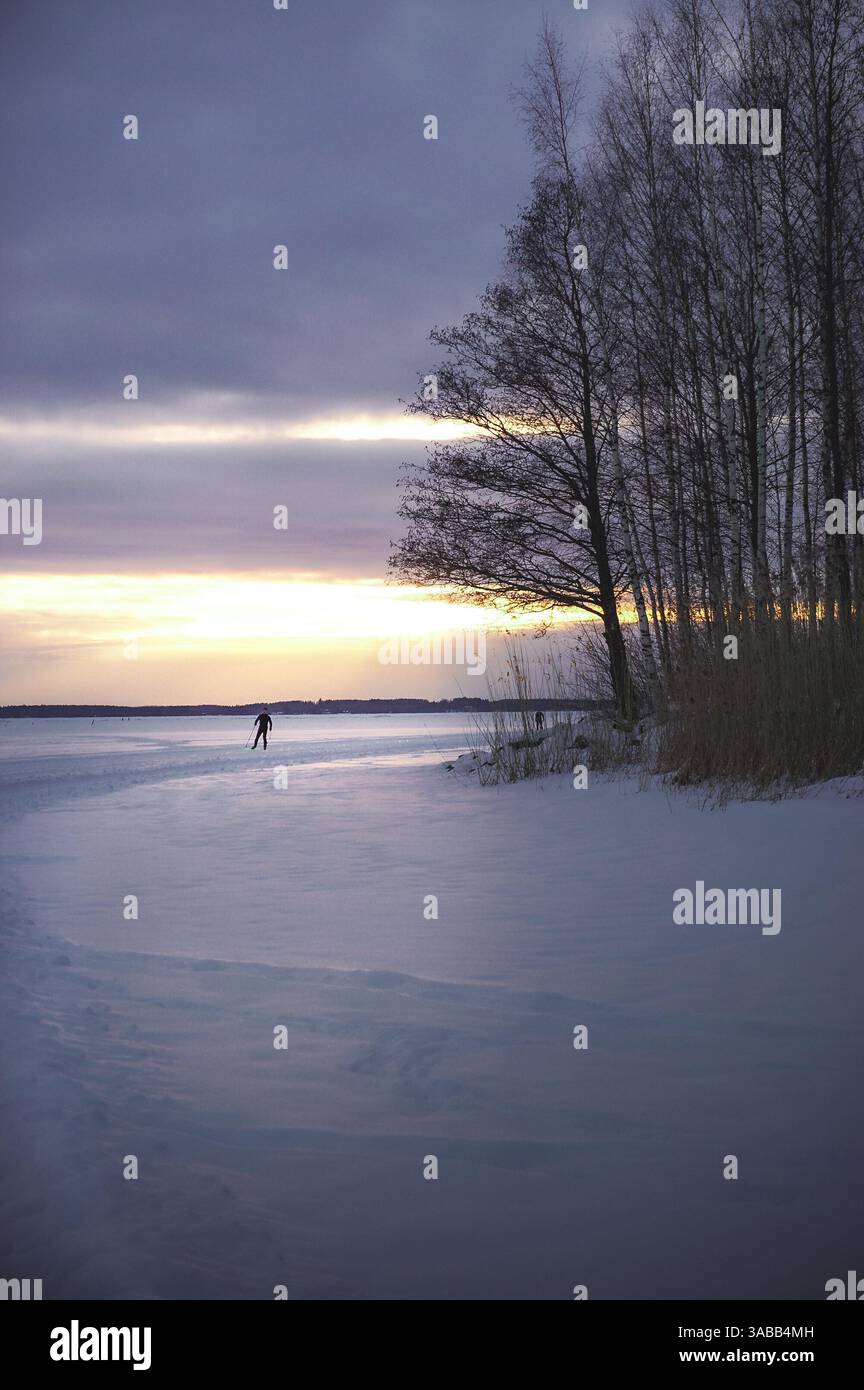Tramonto sul lago ghiacciato Foto Stock