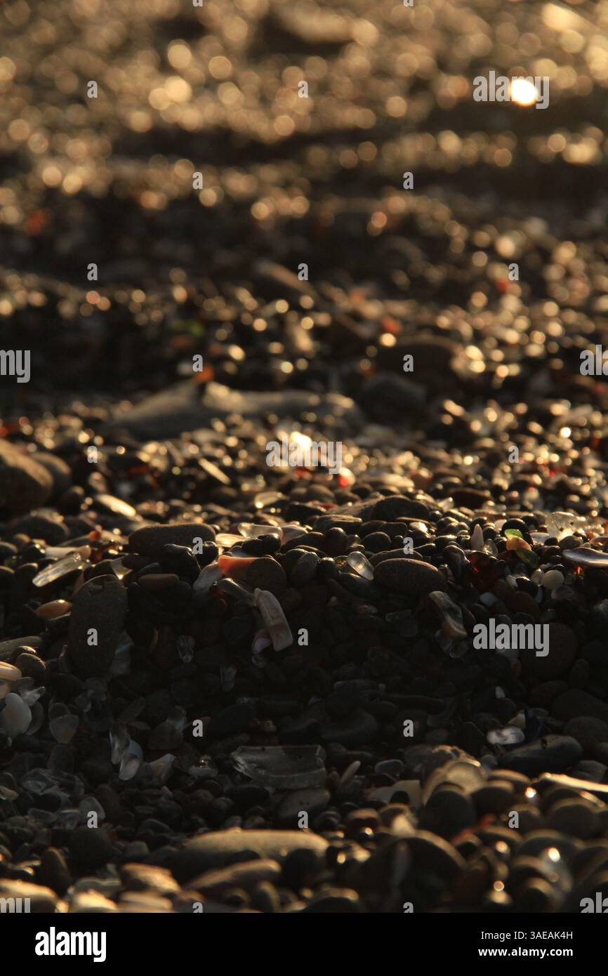 spiaggia di vetro al tramonto Foto Stock
