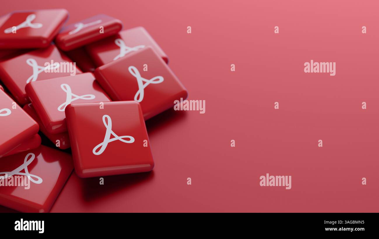 Primo piano del logo del software Adobe Acrobat su una pila su sfondo rosso con spazio di copia come intestazione banner Web Foto Stock