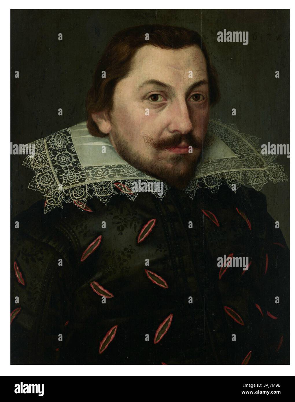 Questo pannello a olio 1617 di Lorenz Strauch presenta un uomo in doppietto di seta con taglio nero e colletto in pizzo Puntonari. Il ritratto firmato e datato mostra dettagliate pennellate e riflette lo stile della nobiltà europea dei primi anni del XVII secolo. Foto Stock