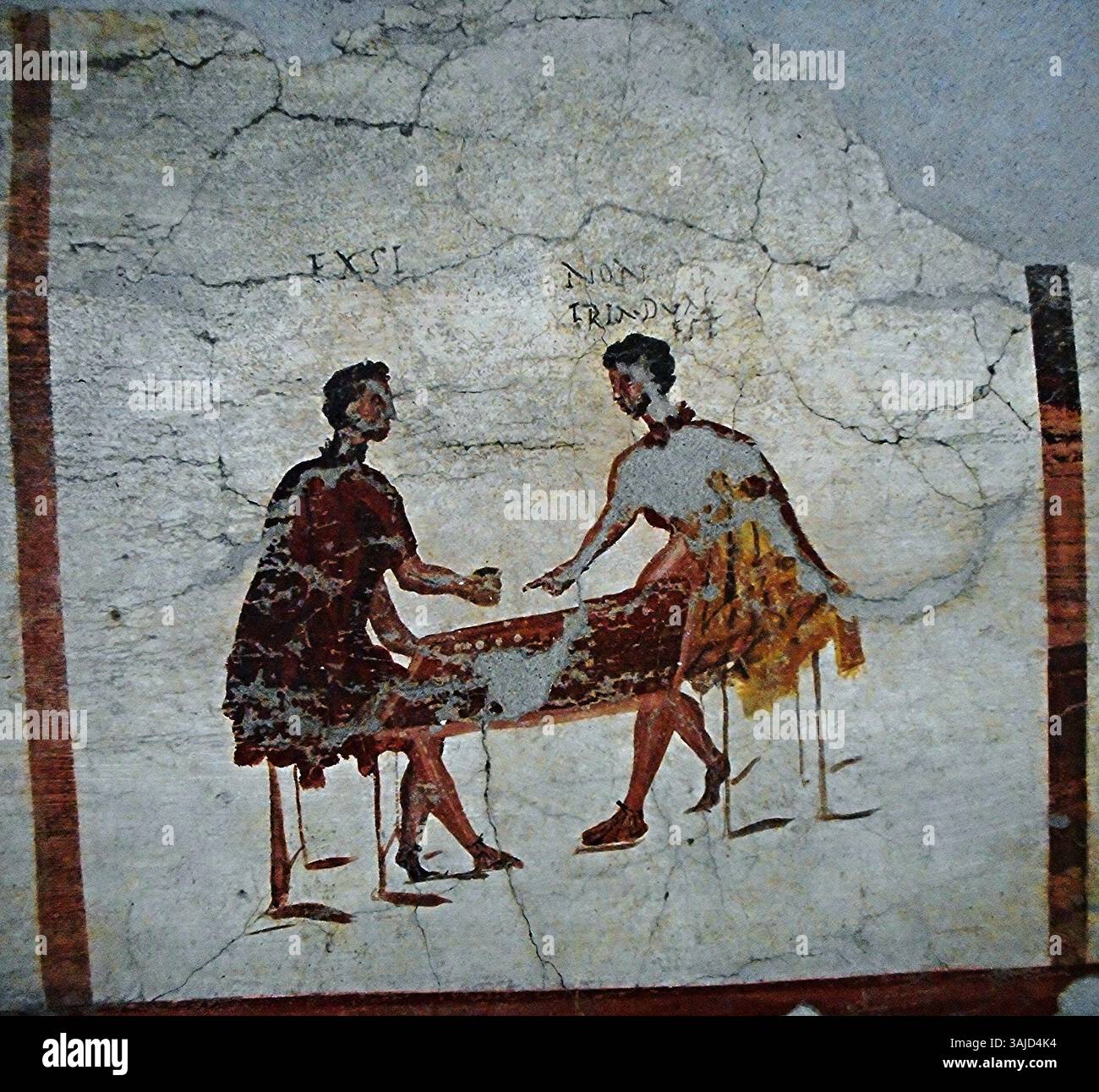 Il dipinto murale "giocatori" di Pompei, risalente a prima del 79 d.C., raffigura una scena di due individui che giocano un gioco. L'opera, conservata nel Museo Archeologico di Napoli, è un significativo esempio di affresco romano. Foto Stock