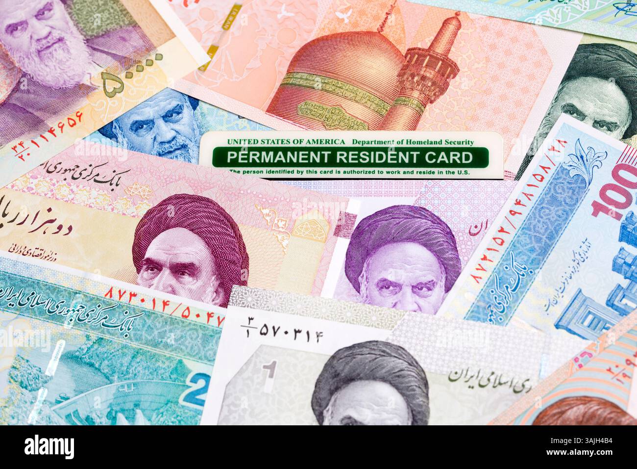 Carta residente permanente americana su un denaro iraniano - Riel Foto Stock