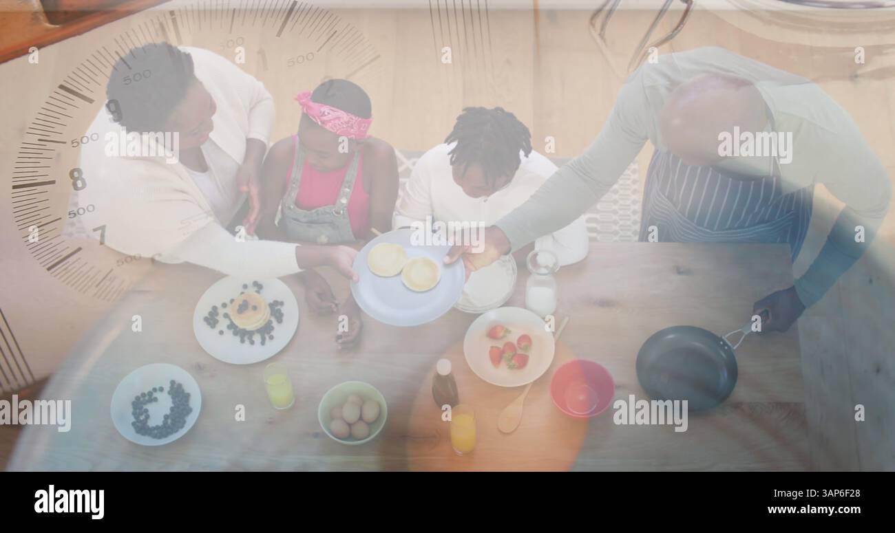 Composto da nonni e nipoti afroamericani che preparano cibo e ingredienti in ciotola Foto Stock