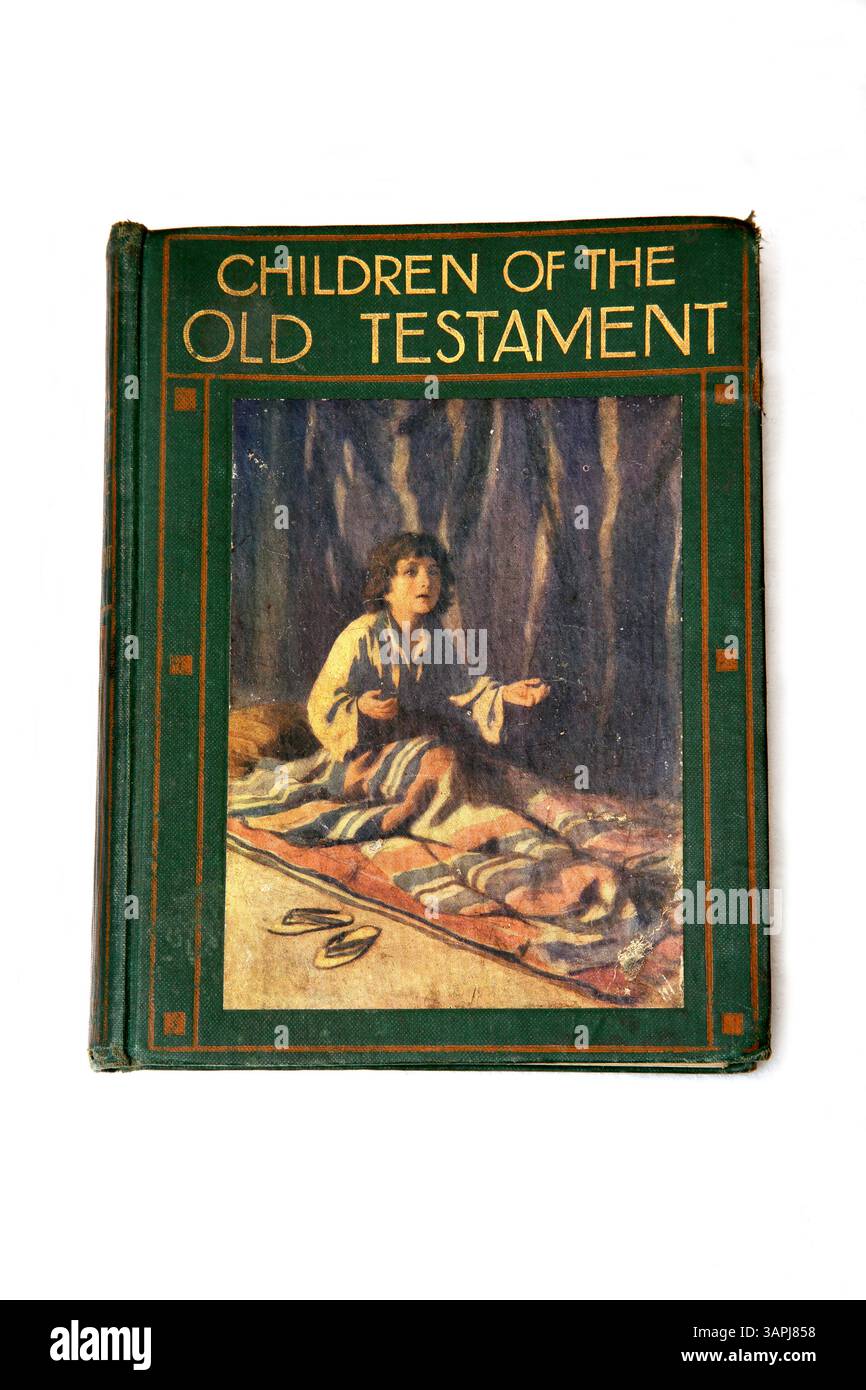 Edizione antica del 1909 dei bambini dell'Antico Testamento raffigurante Samuele che prega e ascolta la voce di Dio sulla copertina Foto Stock