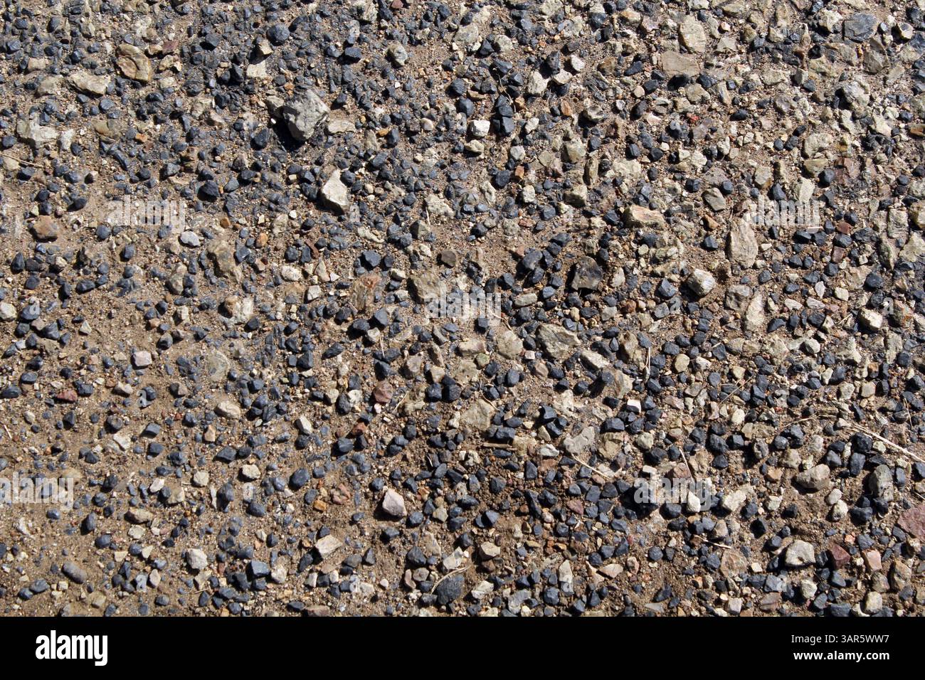 Piccoli sassi e ciottoli, ghiaia, fondo strutturato astratto Foto Stock
