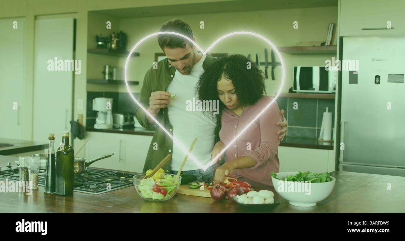 Immagine dell'icona del cuore sulla felice cucina di coppia Foto Stock