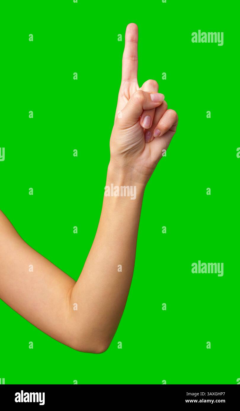 Gesto della mano che indica il numero uno con sfondo verde durante un'attività creativa o educativa Foto Stock