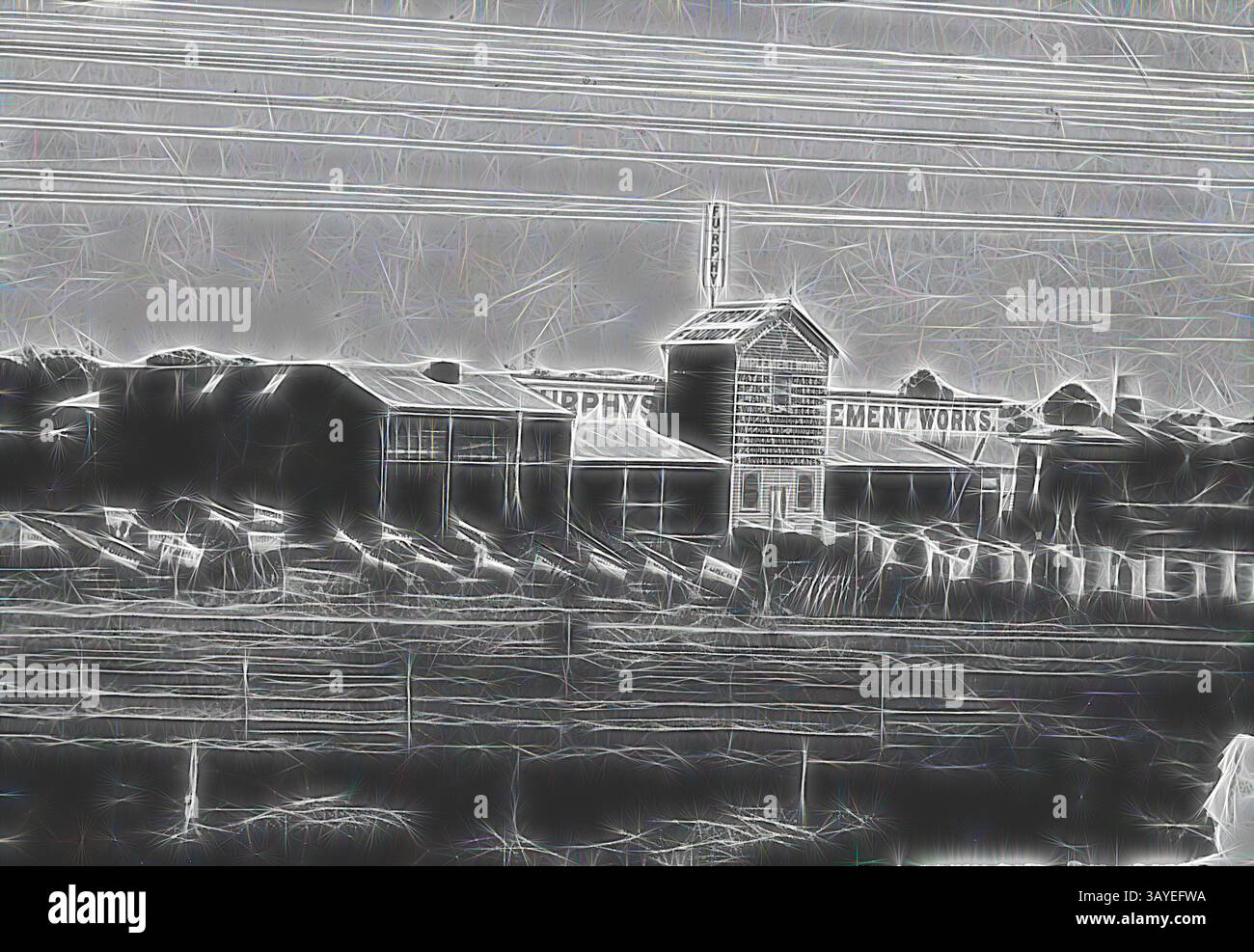 Una collezione di edifici industriali si trova in un paesaggio desolato, con linee elettriche che si estendono attraverso il cielo. Le strutture, segnate da una segnaletica sbiadita, evocano un senso di abbandono e di storia, negativo - Shepparton, Victoria, circa 1905, Furphys Cement Works, Shepparton. Ci sono un certo numero di carretti d'acqua Furphy sulla sinistra e un certo numero di serbatoi d'acqua di varie dimensioni sulla destra. Arte classica con un tocco moderno reinventata da Artotop Foto Stock