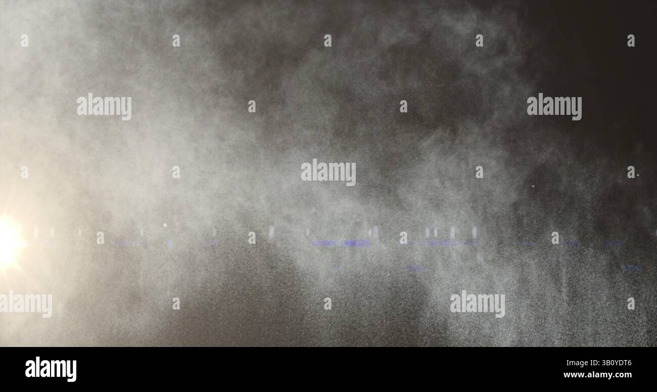 Immagine di macchie luminose e tracce di fumo su sfondo nero Foto Stock