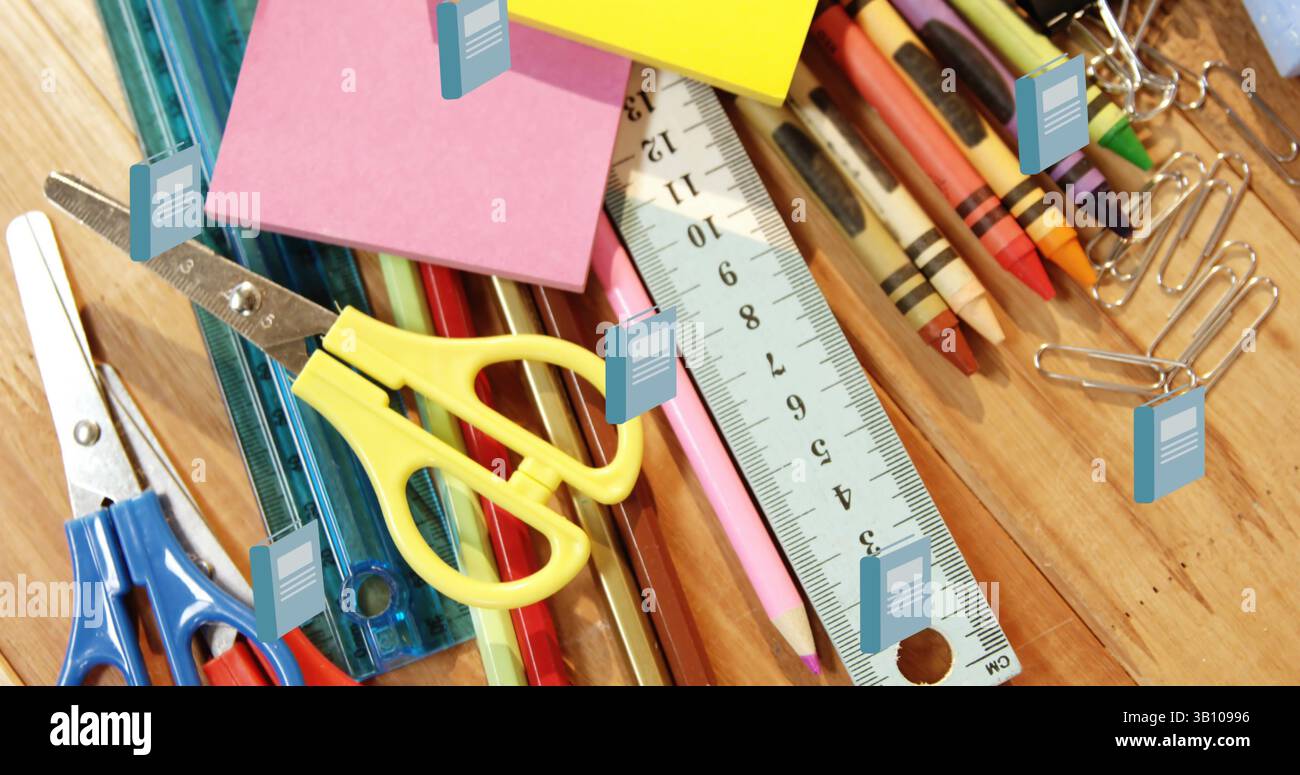 Immagine di libri di scuola blu che si muovono su pastelli colorati e articoli di cancelleria assortiti Foto Stock