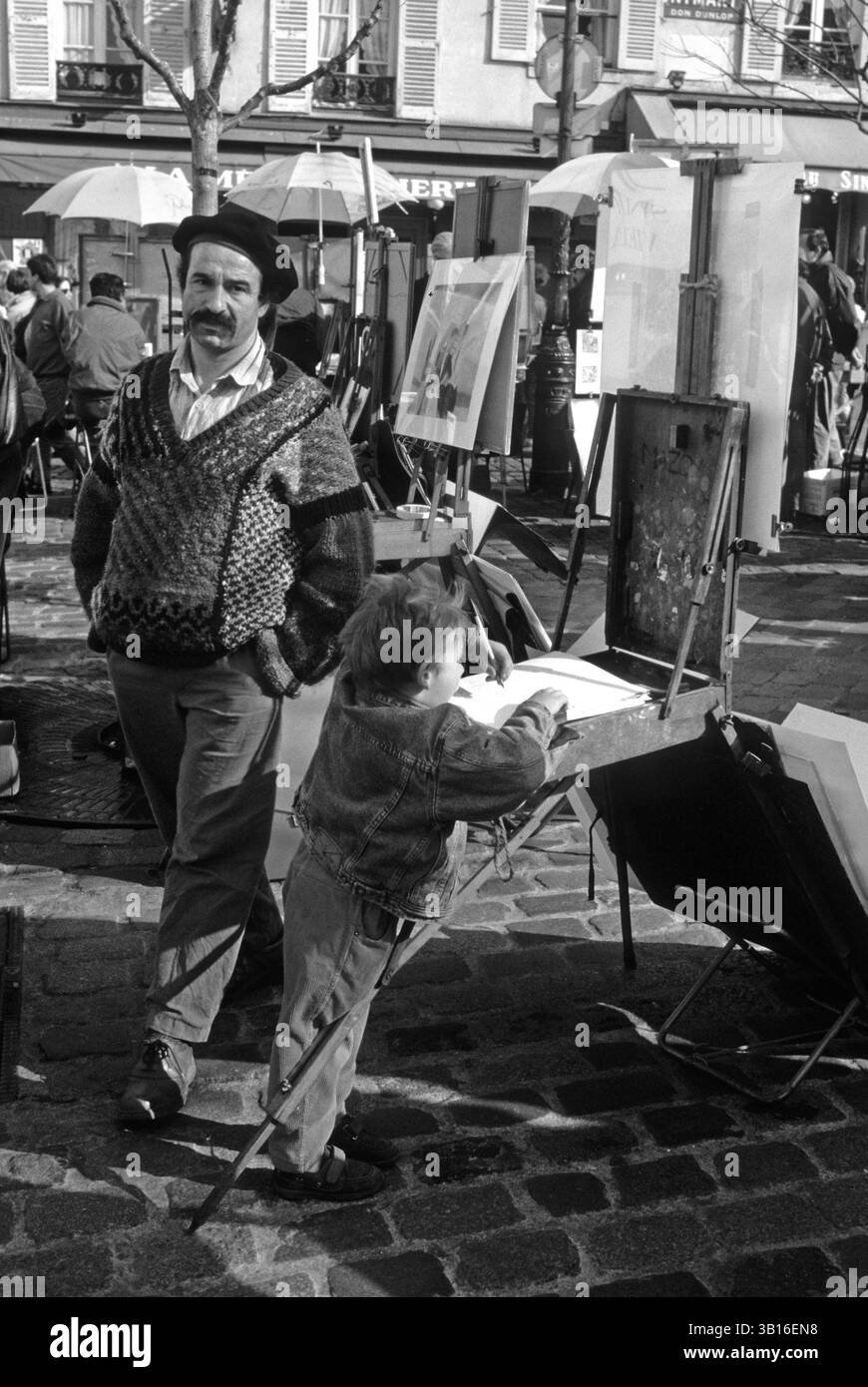 Artista e bambino montmartre Parigi Francia Foto Stock