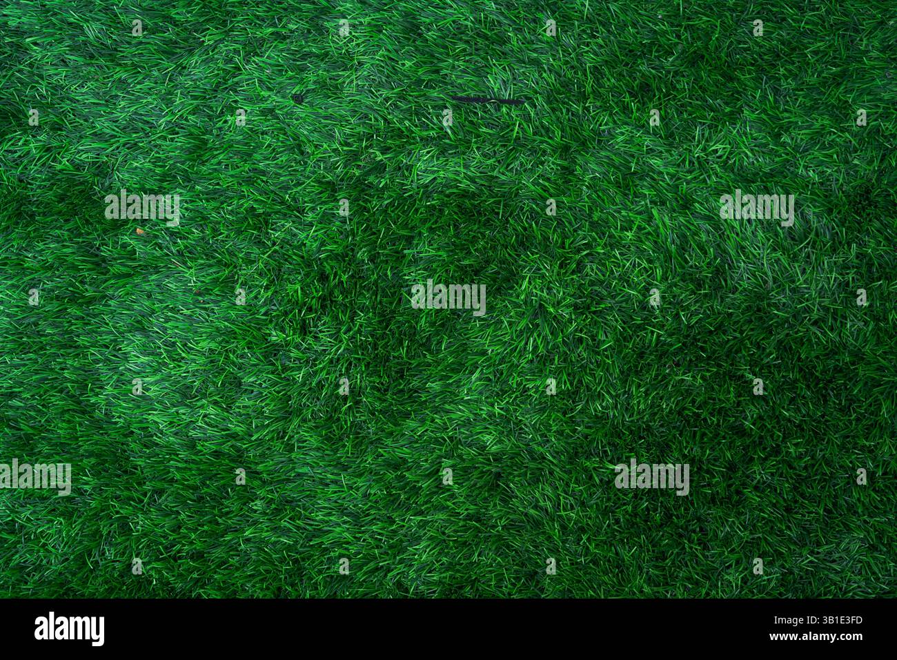 Trama verde sintetica erba, perfetta per lo sfondo e spazio di copia per l'immissione del testo Foto Stock