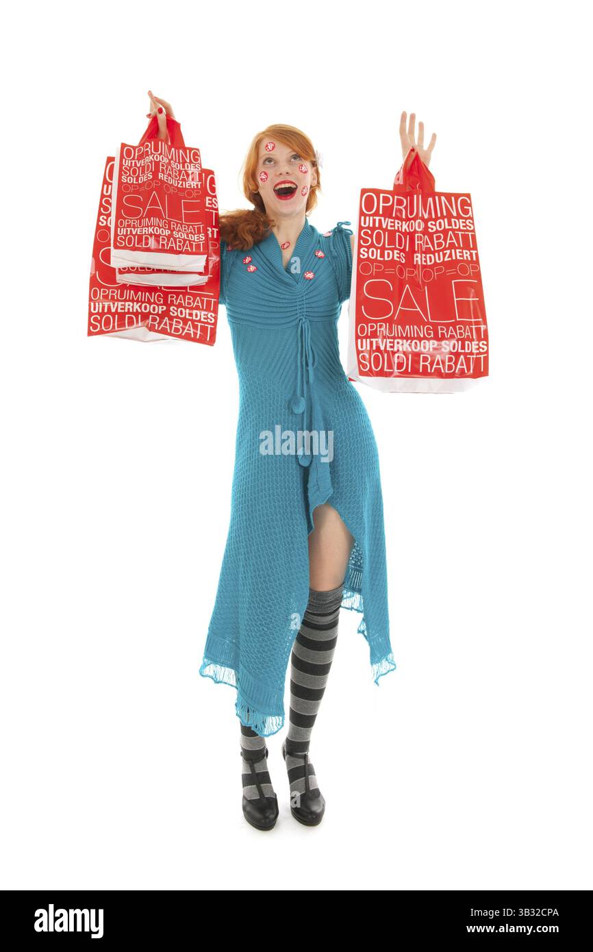 Donna durante la stagione vendita con borse Foto Stock