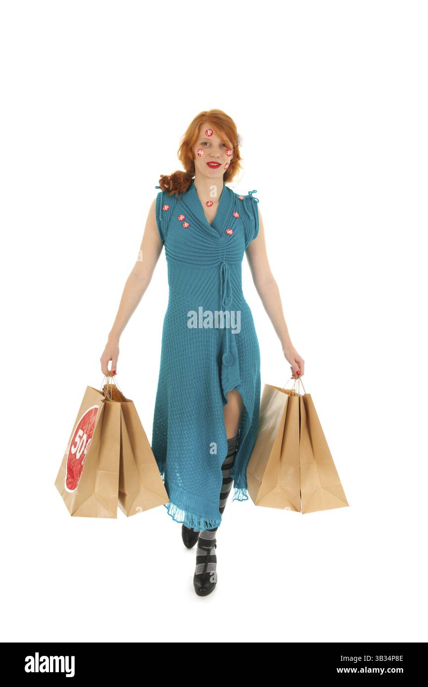 Donna durante la stagione vendita con borse Foto Stock
