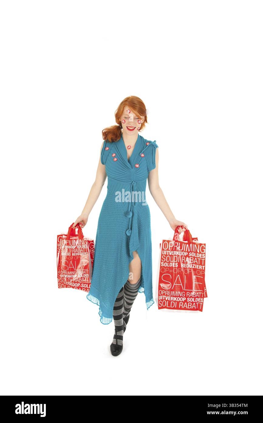 Donna durante la stagione vendita con borse Foto Stock